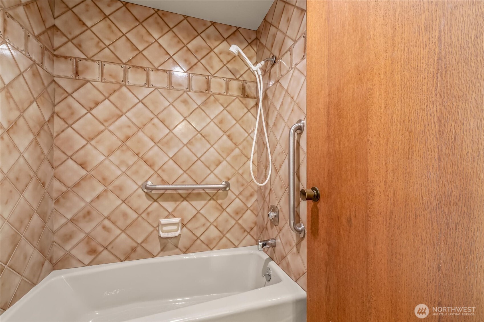 505 West Roy Street, Unit 304 Seattle, WA 98119 - Photo 18 of 33 a bathroom with a white bath tub and a shower curtain