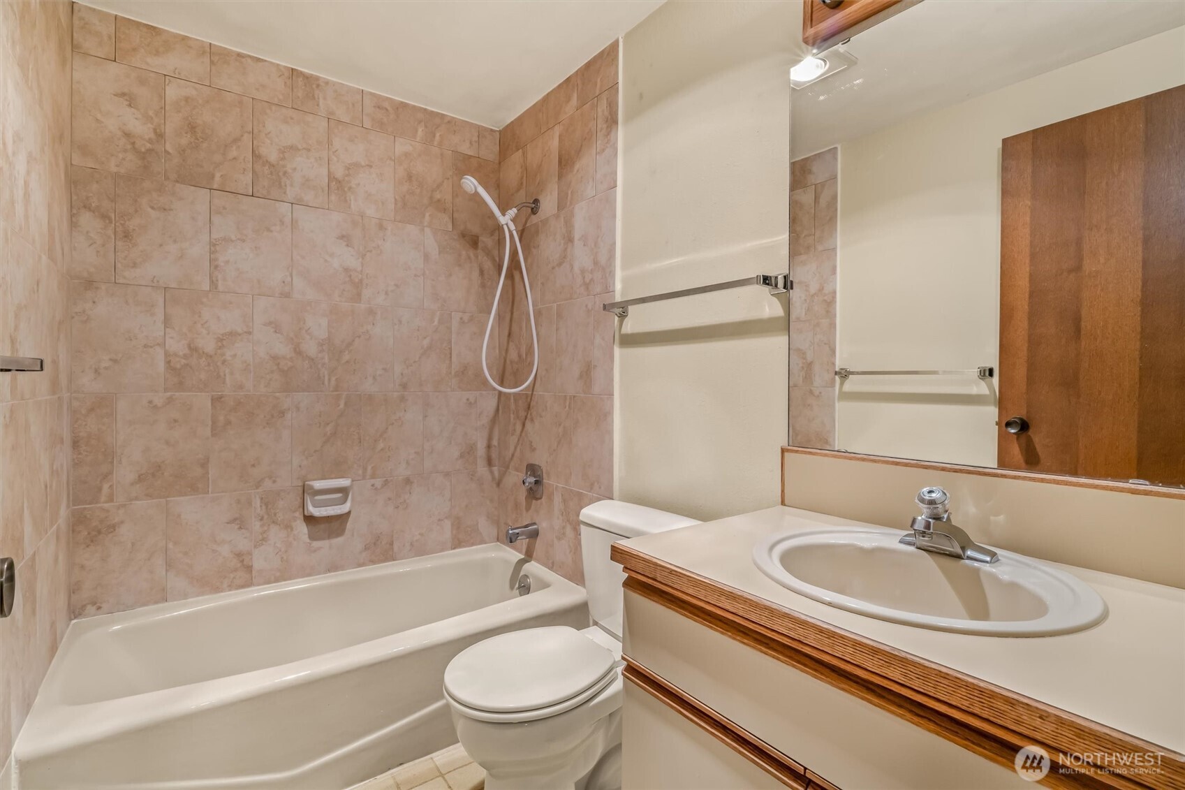 505 West Roy Street, Unit 304 Seattle, WA 98119 - Photo 20 of 33 a bathroom with a granite countertop sink toilet and shower