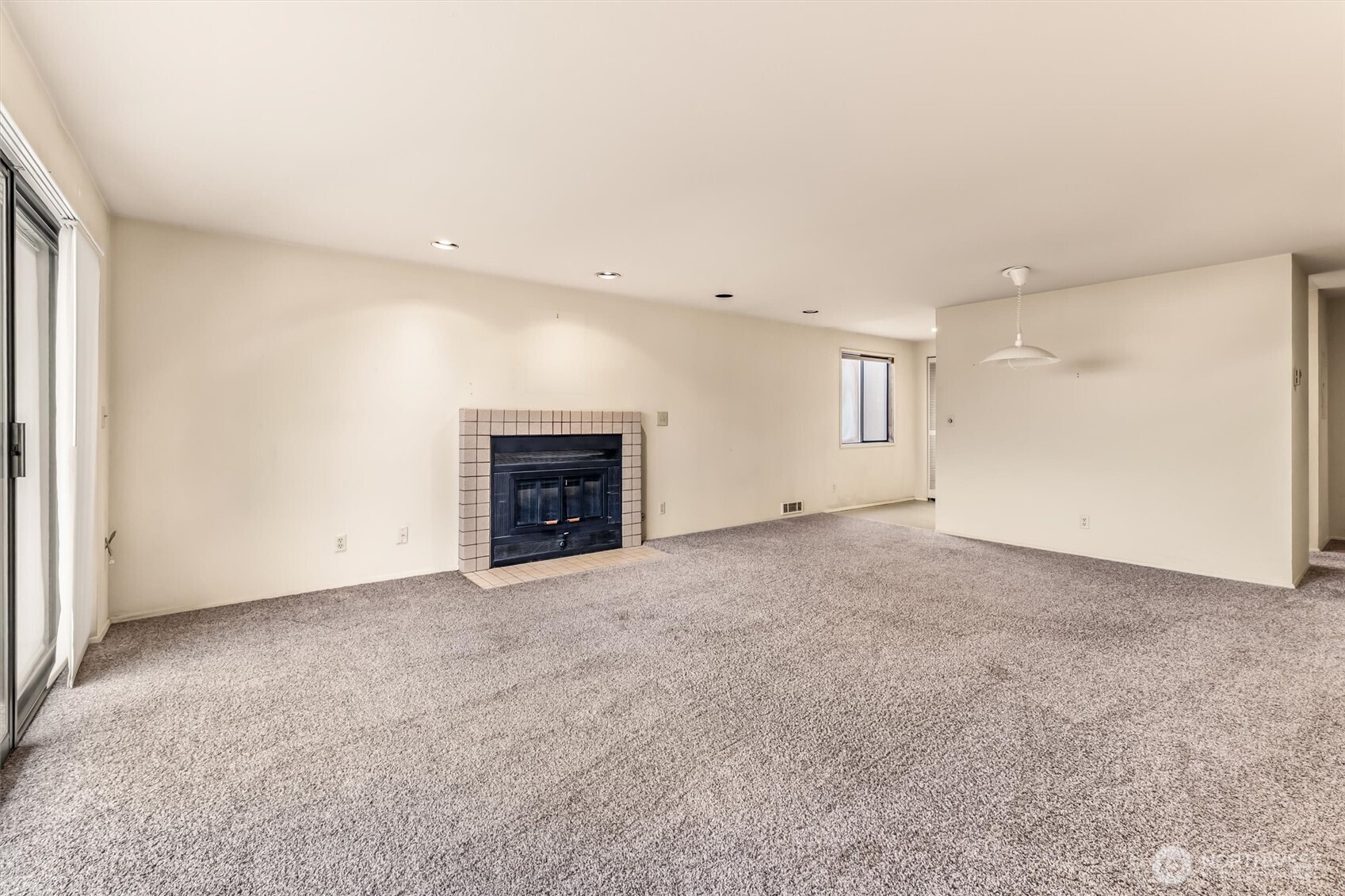 505 West Roy Street, Unit 304 Seattle, WA 98119 - Photo 6 of 33 an empty room with fireplace