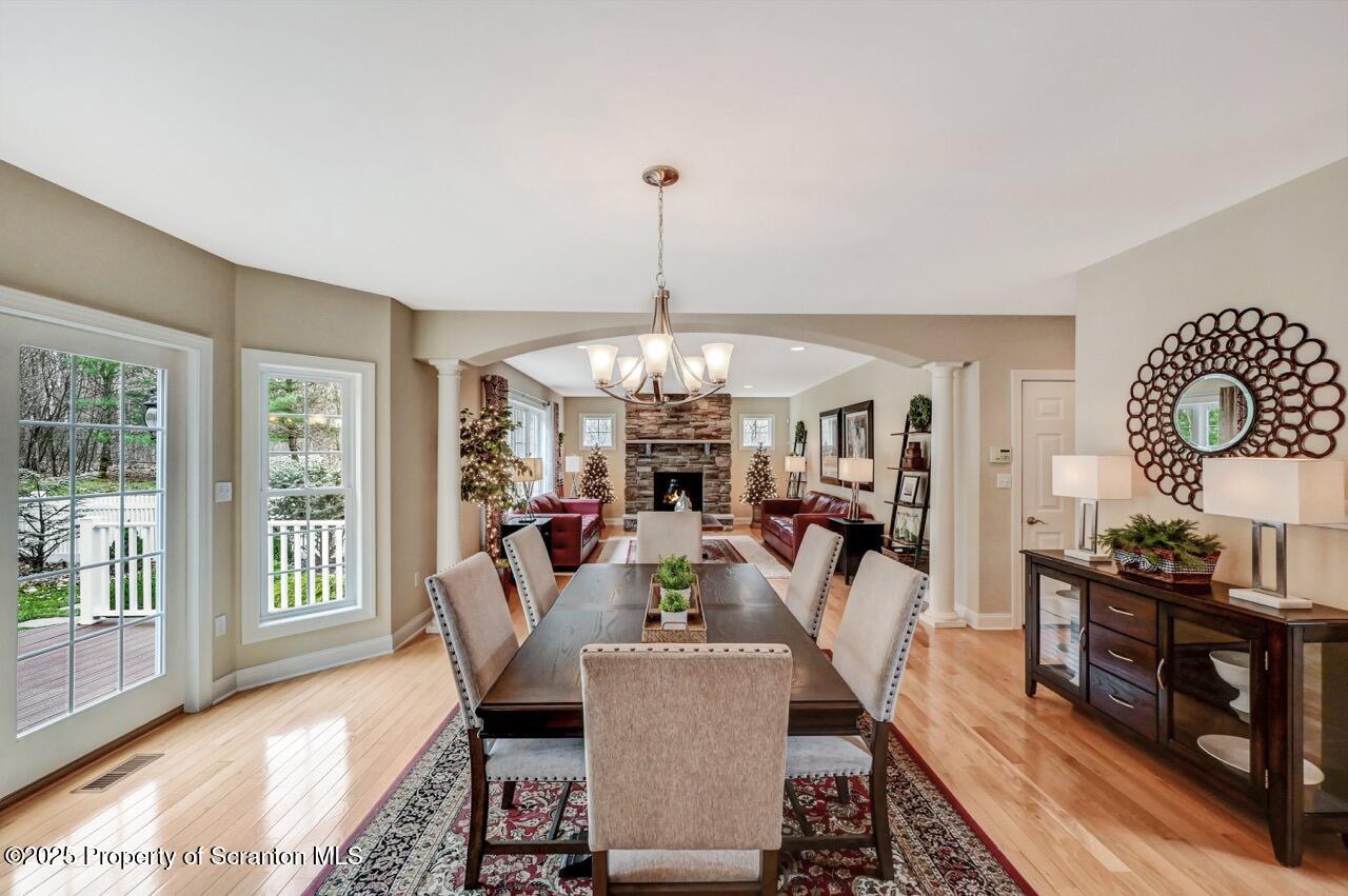 120 Highland Road Moscow, PA 18444 - Photo 23 of 84 a living room with furniture and a chandelier