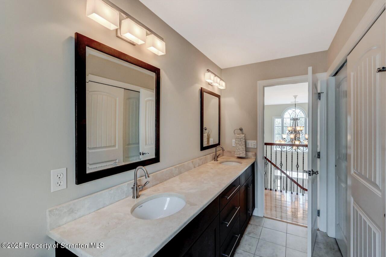 120 Highland Road Moscow, PA 18444 - Photo 54 of 84 a en suite bathroom with a sink double vanity and mirror