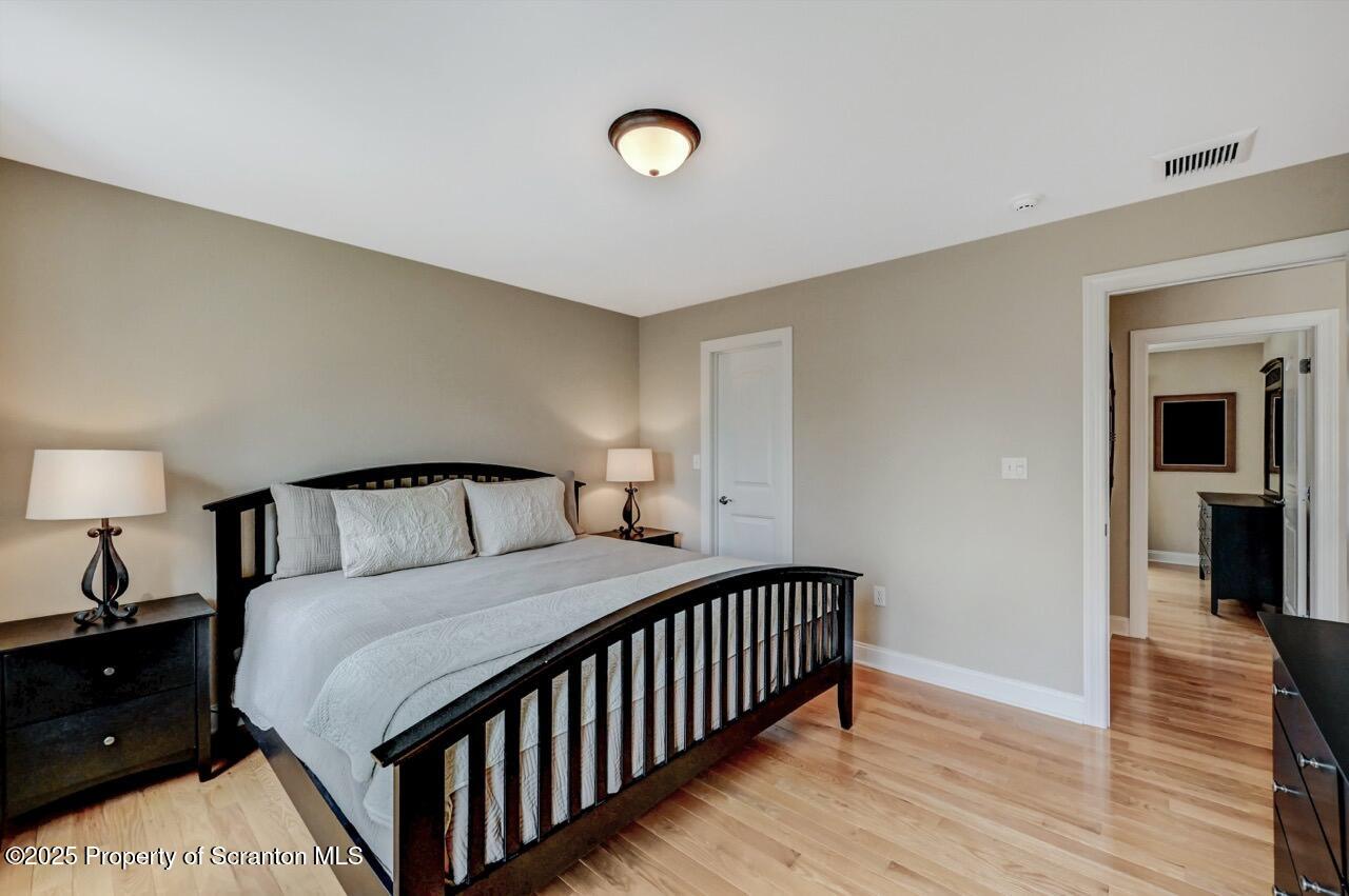 120 Highland Road Moscow, PA 18444 - Photo 56 of 84 a bedroom with a bed and a lamp on table
