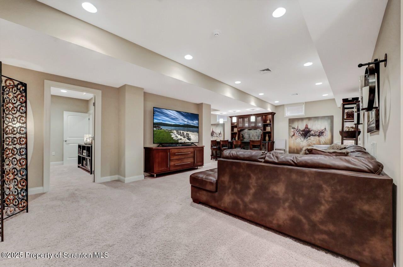 120 Highland Road Moscow, PA 18444 - Photo 71 of 84 a living room with furniture and a flat screen tv
