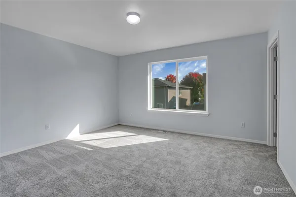 a bathroom with a granite countertop sink toilet a mirror and bathtub