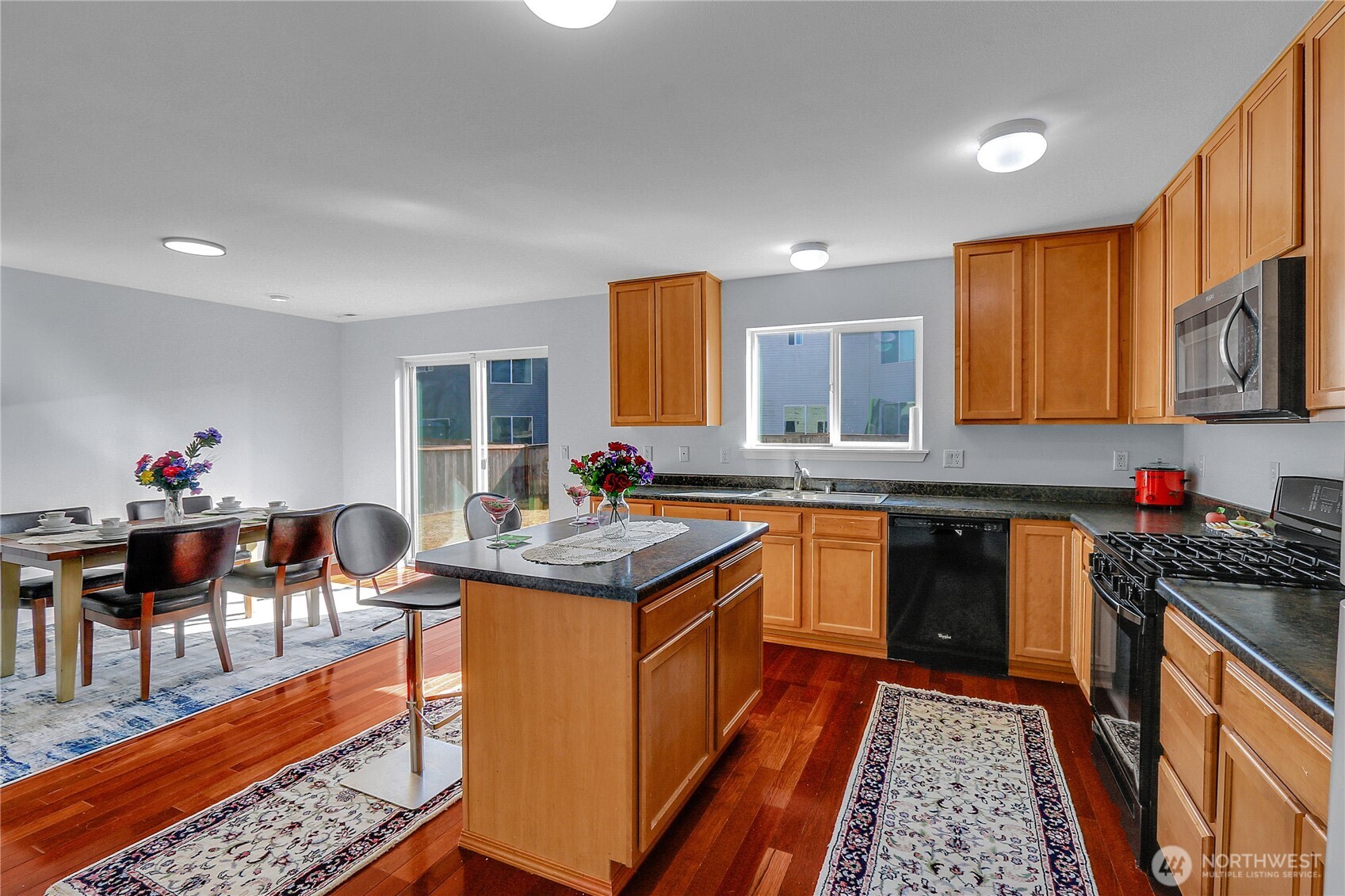 21545 Southeast 298th Place Kent, WA 98042 - Photo 8 of 22 a kitchen with stainless steel appliances granite countertop sink stove top oven and cabinets