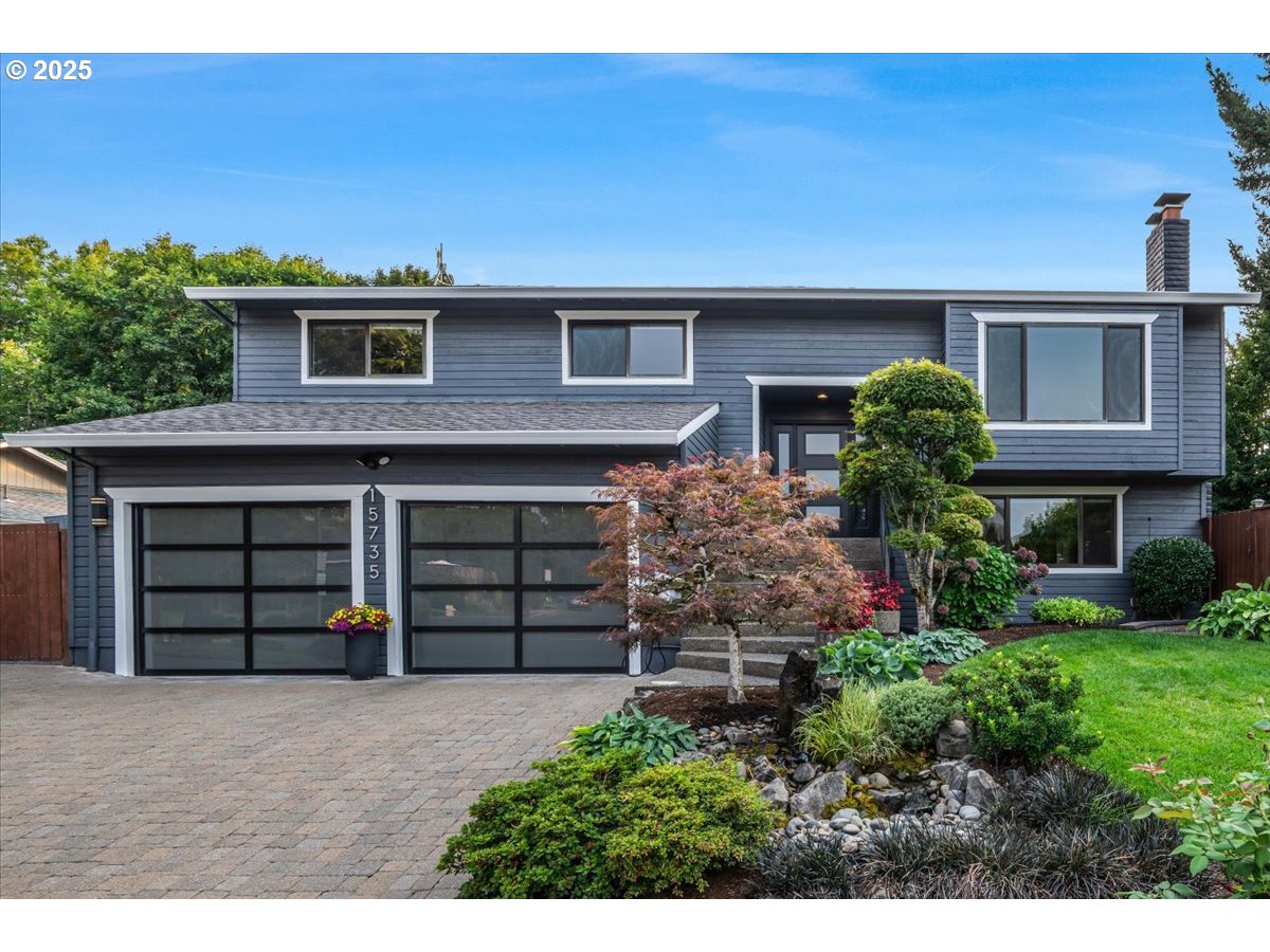 15735 Southwest 88th Avenue Portland, OR 97224 - Photo 1 of 38 a front view of a house with a yard