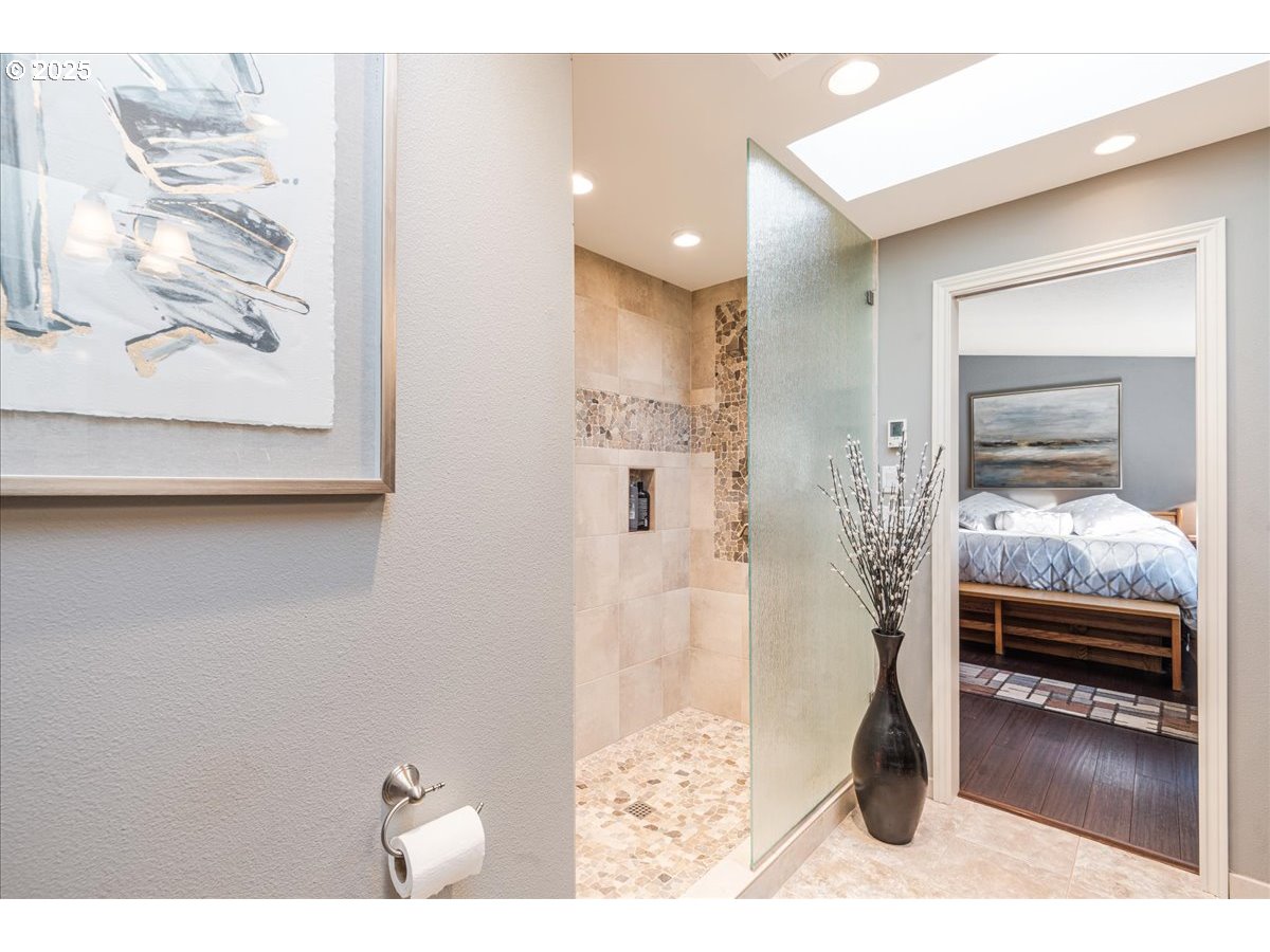 15735 Southwest 88th Avenue Portland, OR 97224 - Photo 20 of 38 a bedroom with a bed and a view of living room