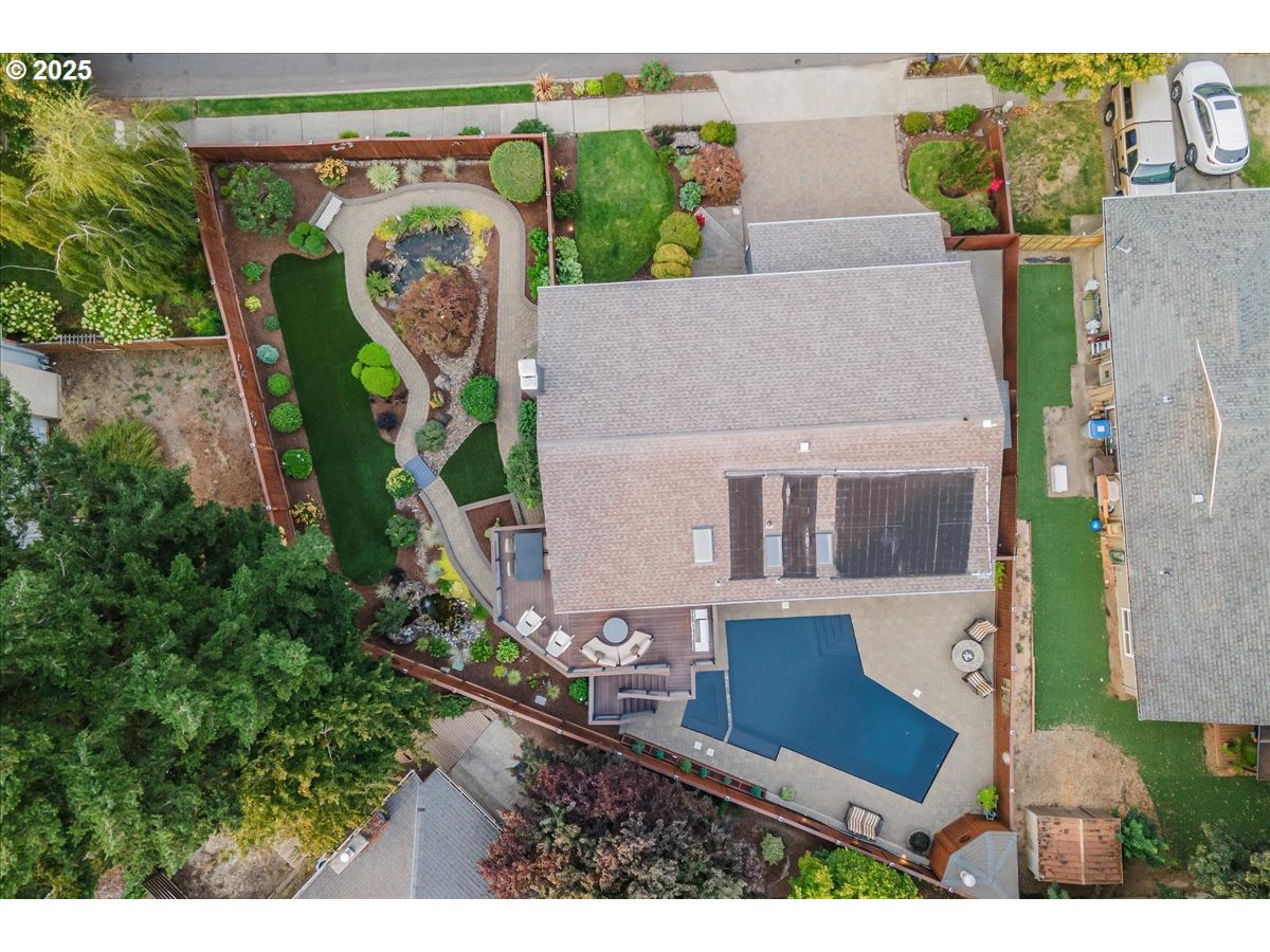 15735 Southwest 88th Avenue Portland, OR 97224 - Photo 2 of 38 an aerial view of a house with garden space and street view