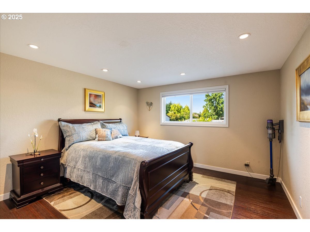 15735 Southwest 88th Avenue Portland, OR 97224 - Photo 21 of 38 a bedroom with a bed and a view of bathroom