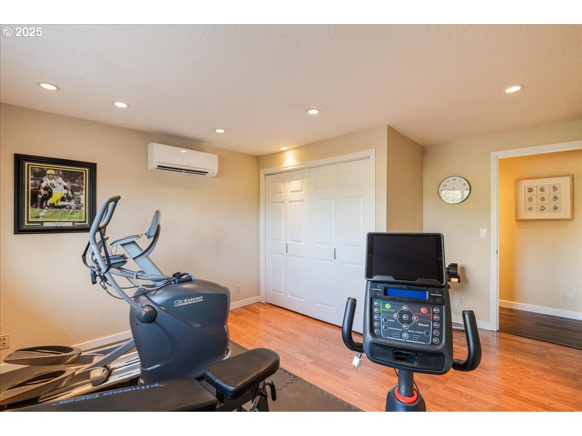 15735 Southwest 88th Avenue Portland, OR 97224 - Photo 23 of 38 a living room with furniture and a flat screen tv
