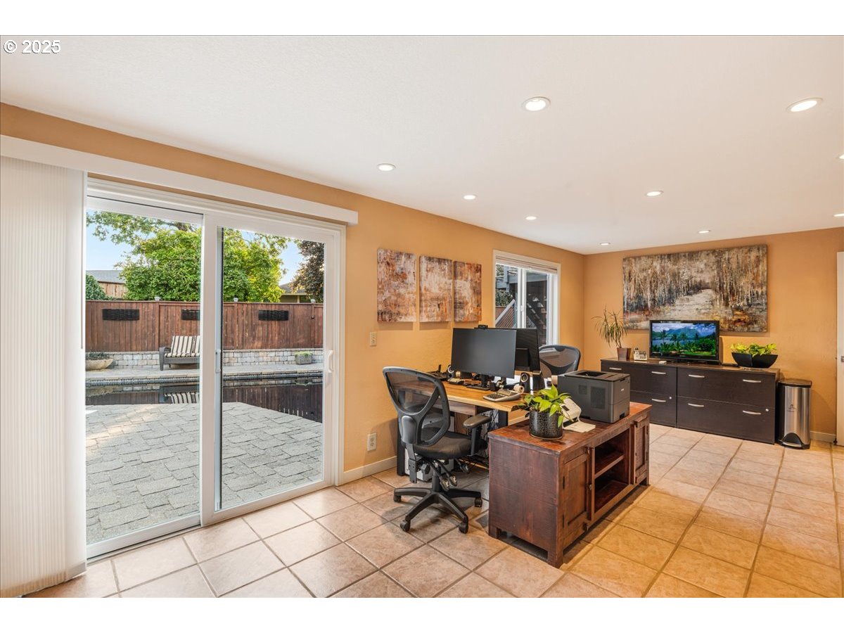 15735 Southwest 88th Avenue Portland, OR 97224 - Photo 25 of 38 a living room with furniture a rug and a large window