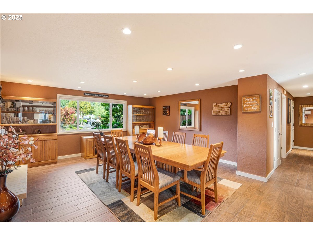 15735 Southwest 88th Avenue Portland, OR 97224 - Photo 29 of 38 a view of a dining room with furniture window and wooden floor