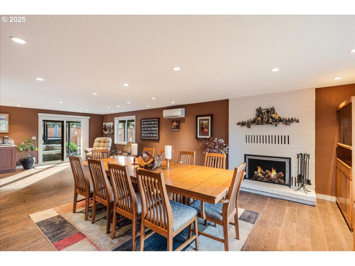 15735 Southwest 88th Avenue Portland, OR 97224 - Photo 30 of 38 a dining room with furniture and fireplace