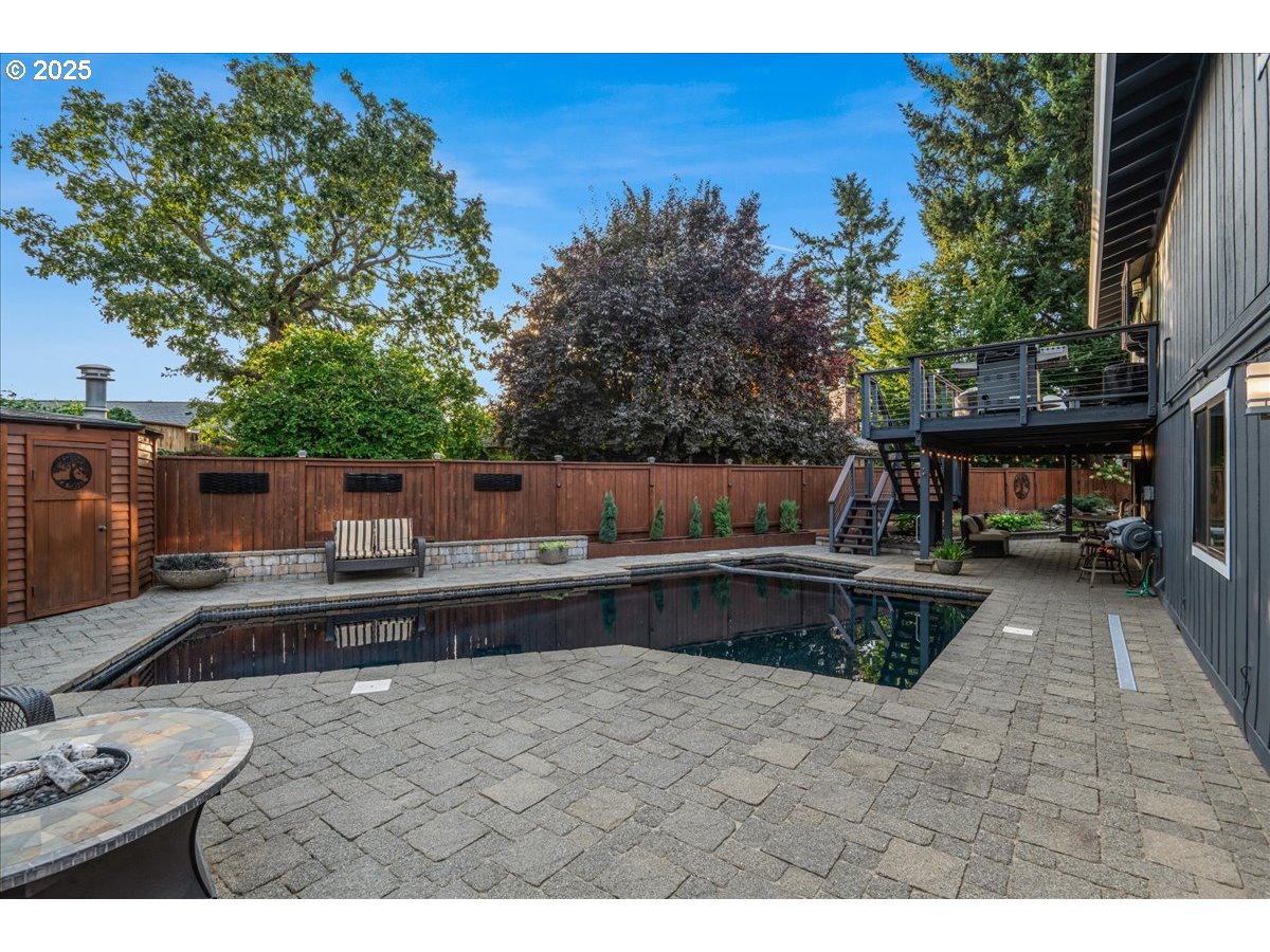 15735 Southwest 88th Avenue Portland, OR 97224 - Photo 34 of 38 a view of a swimming pool with a patio