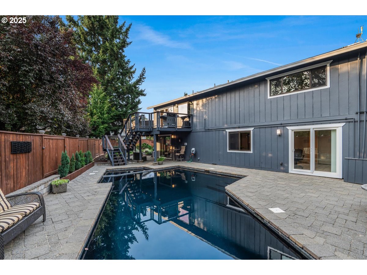 15735 Southwest 88th Avenue Portland, OR 97224 - Photo 35 of 38 a view of a house with backyard patio and sitting area