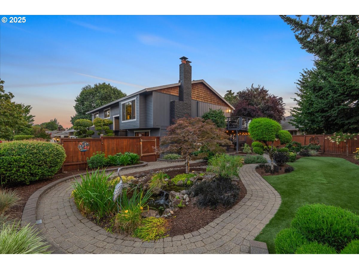 15735 Southwest 88th Avenue Portland, OR 97224 - Photo 4 of 38 a front view of a house with a yard