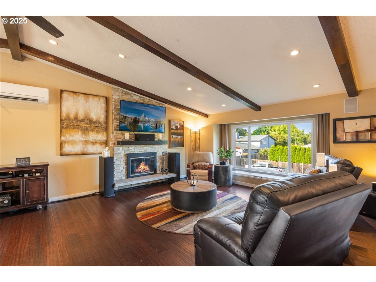 15735 Southwest 88th Avenue Portland, OR 97224 - Photo 6 of 38 a living room with fireplace furniture and a large window