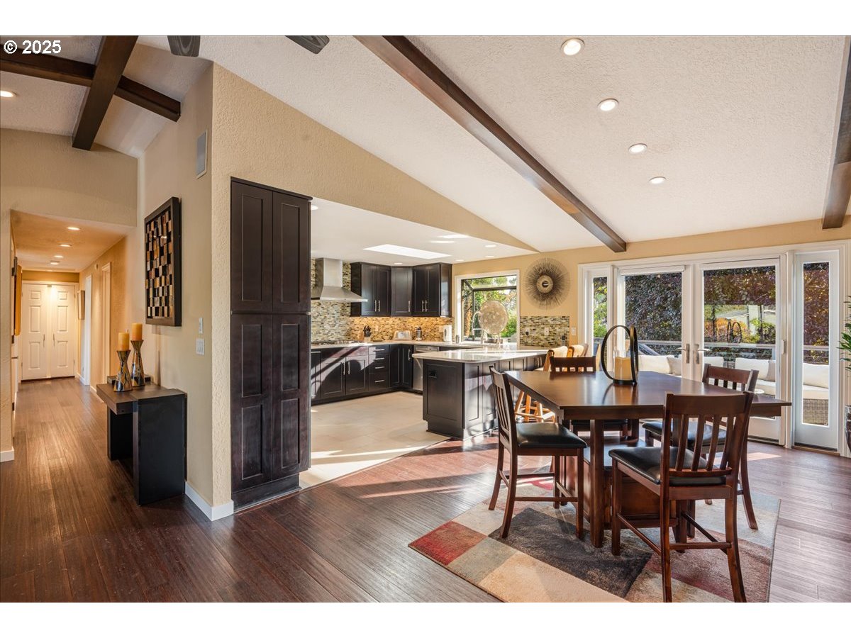 15735 Southwest 88th Avenue Portland, OR 97224 - Photo 10 of 38 a view of a dining room with furniture and wooden floor
