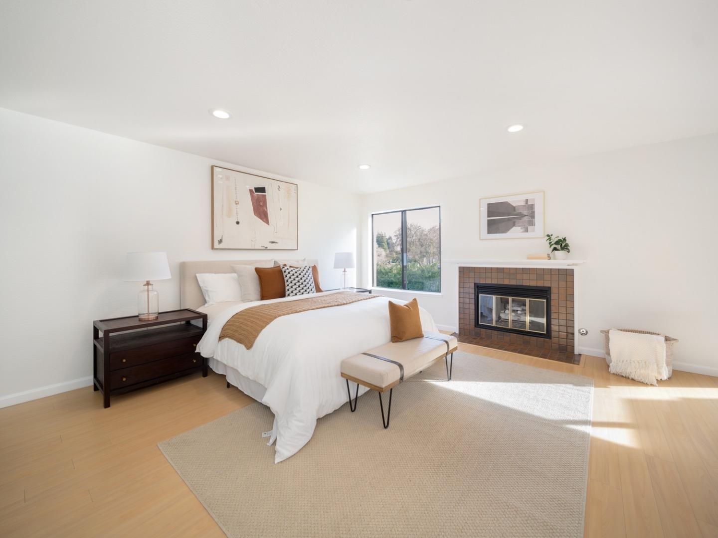 7518 Rosedale Court Pleasanton, CA 94588 - Photo 12 of 27 a spacious bedroom with a bed and a fireplace
