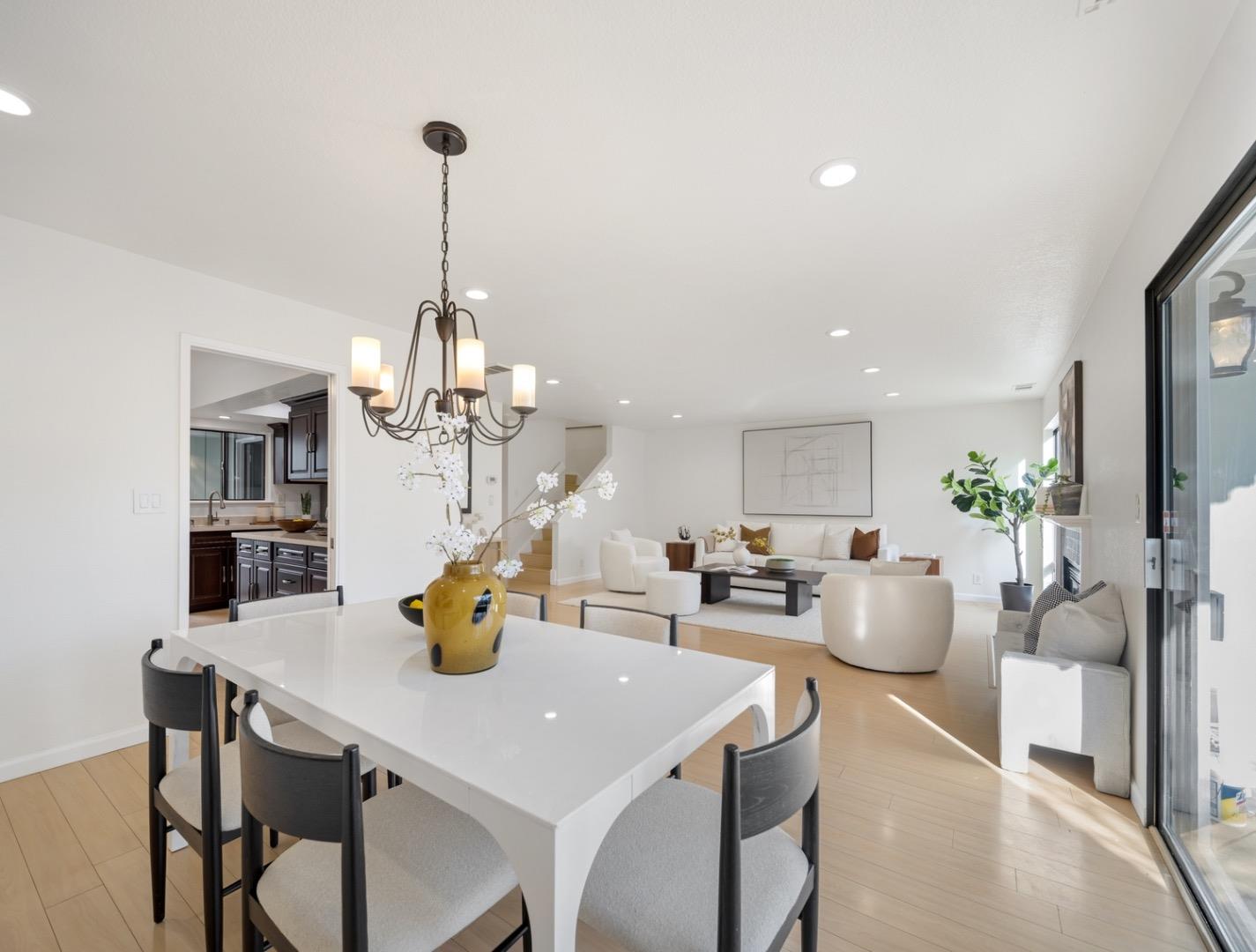7518 Rosedale Court Pleasanton, CA 94588 - Photo 6 of 27 a view of a dining room and livingroom with furniture a chandelier and wooden floor