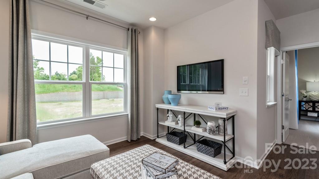 13224 Chopin Ridge Road Huntersville, NC 28078 - Photo 18 of 33 a living room with furniture and a flat screen tv