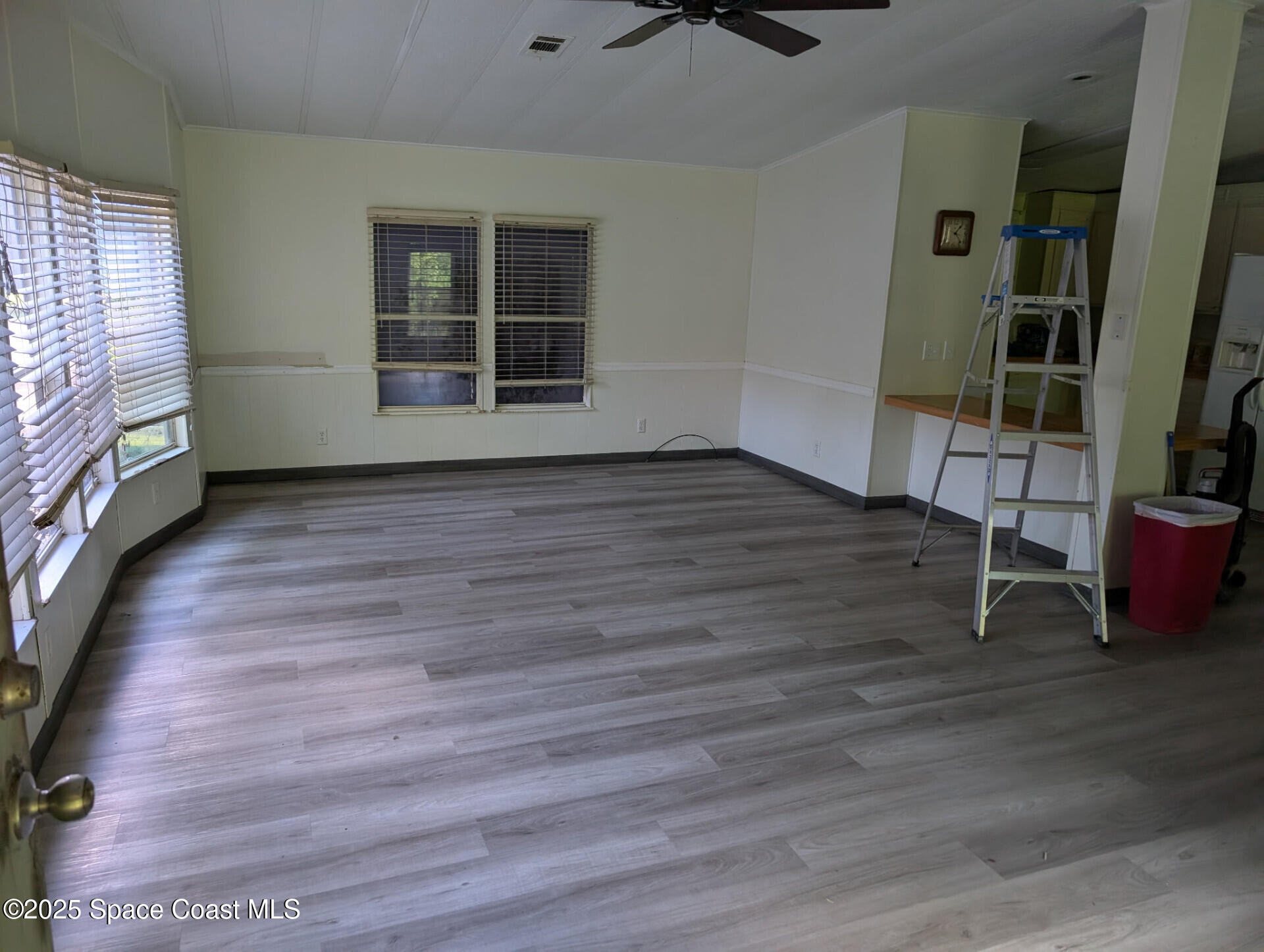 3640 Sandy Pine Place Cocoa, FL 32926 - Photo 2 of 9 wooden floor in an empty room with a window