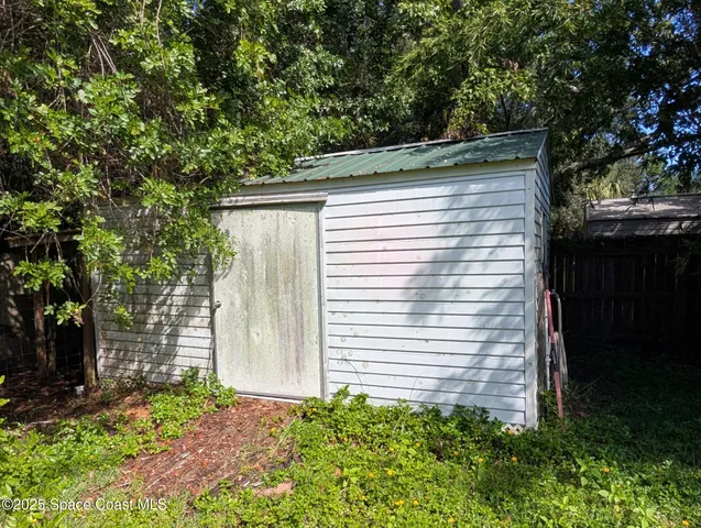 a side view of a house with a yard