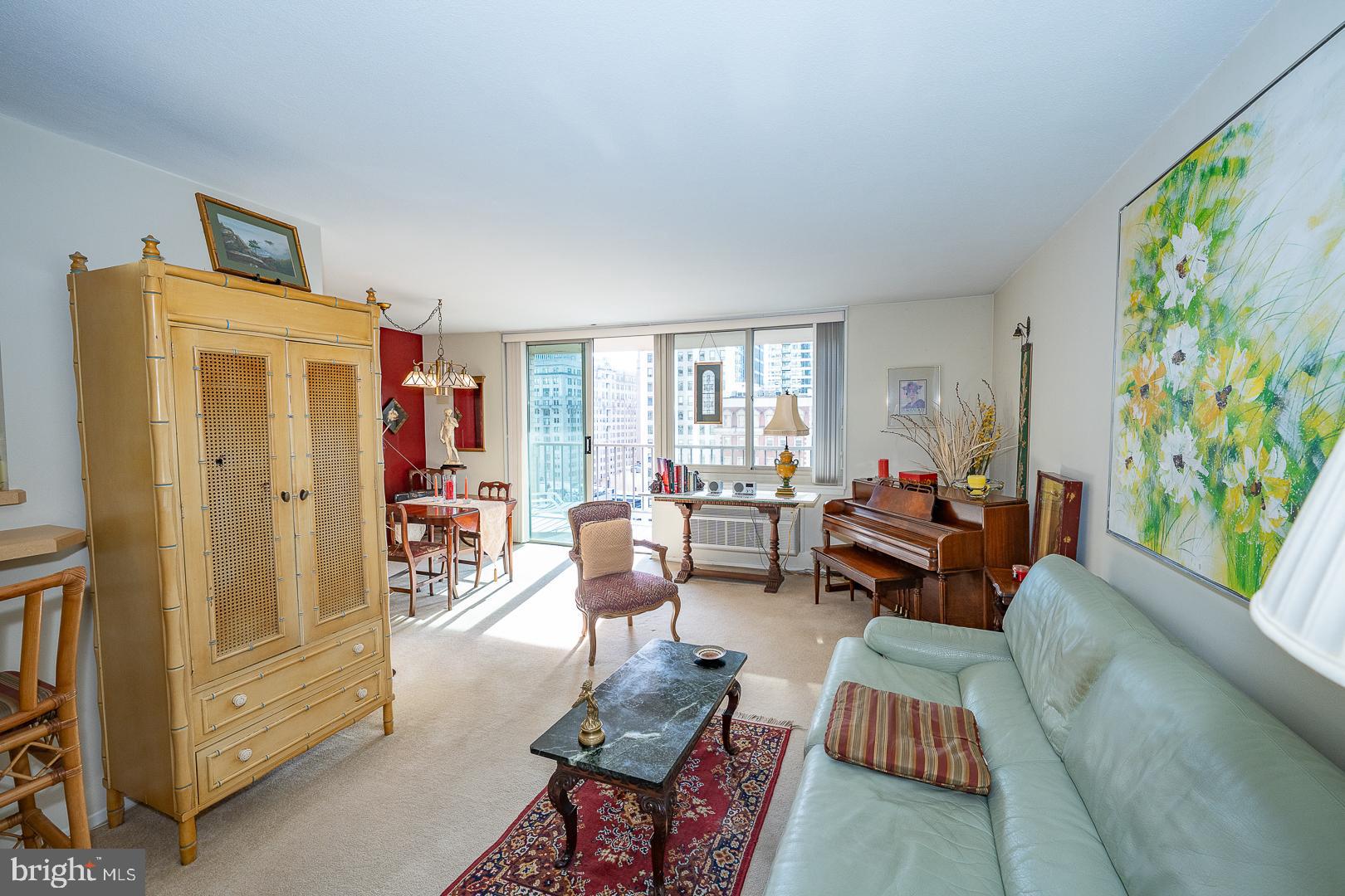 1919 Chestnut Street, Unit 1316 Philadelphia, PA 19103 - Photo 2 of 24 a living room with furniture and a window