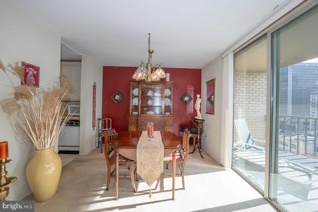 a dining room with furniture and wooden floor