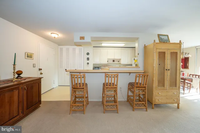 a kitchen with stainless steel appliances kitchen island granite countertop a sink and cabinets