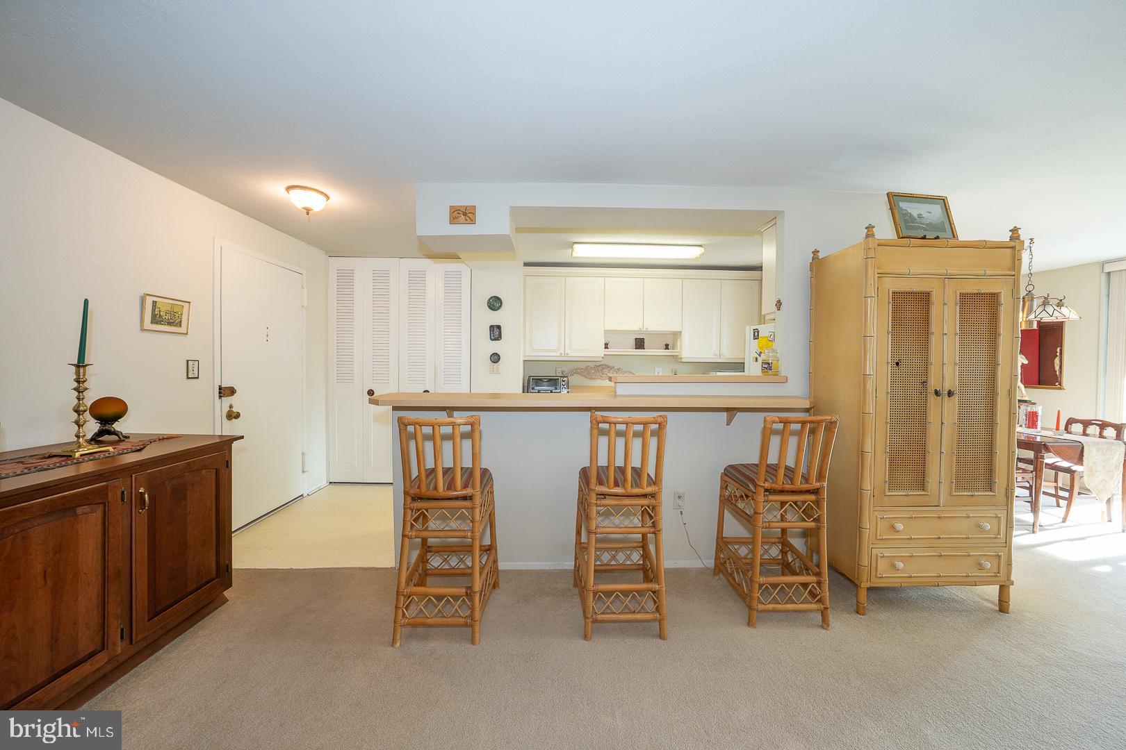 1919 Chestnut Street, Unit 1316 Philadelphia, PA 19103 - Photo 6 of 24 a kitchen with stainless steel appliances kitchen island granite countertop a sink and cabinets