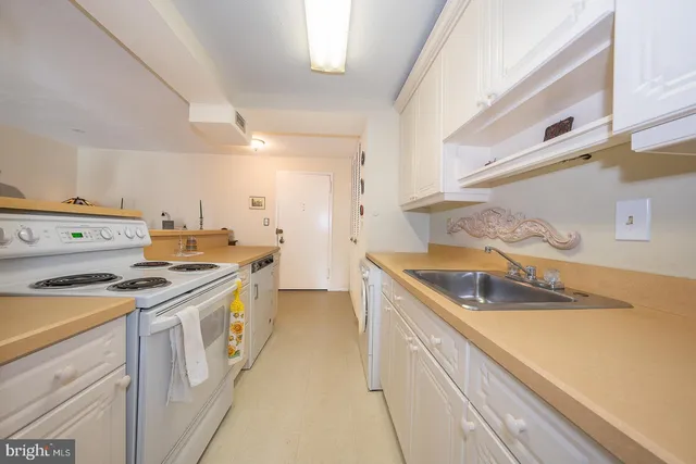 a kitchen with a stove and a sink