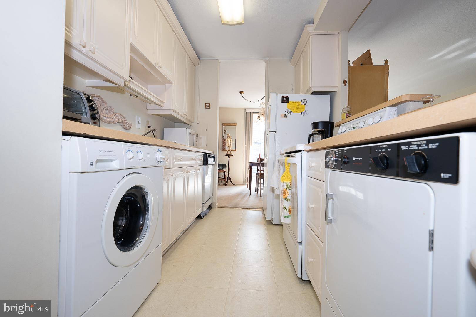1919 Chestnut Street, Unit 1316 Philadelphia, PA 19103 - Photo 8 of 24 a utility room with dryer and washer