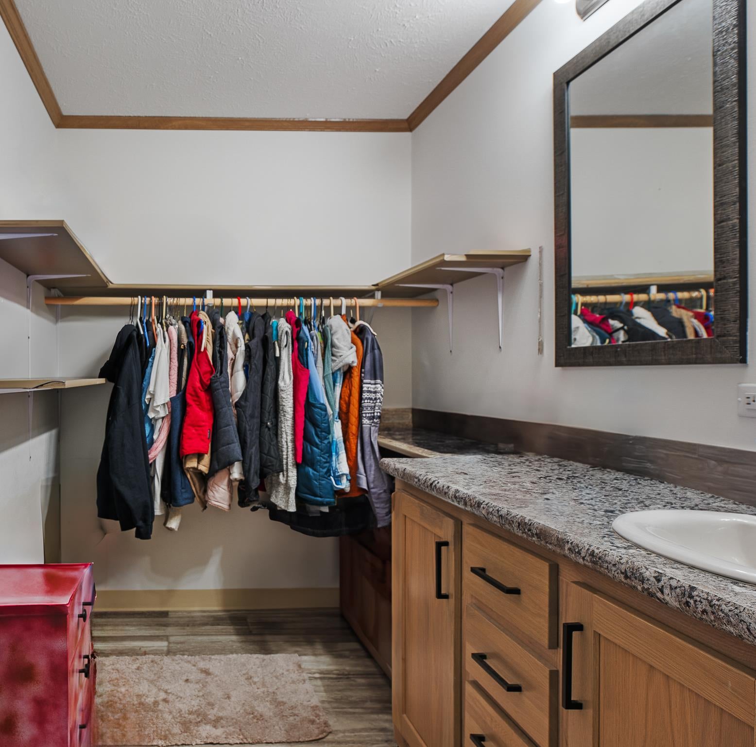 1040 Round Butte Road, Unit 34 Ronan, MT 59864 - Photo 18 of 30 Walk in closet with hardwood / wood-style flooring and sink