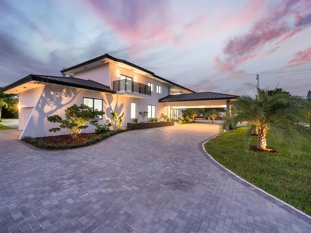 a view of a house with a yard porch and sitting area