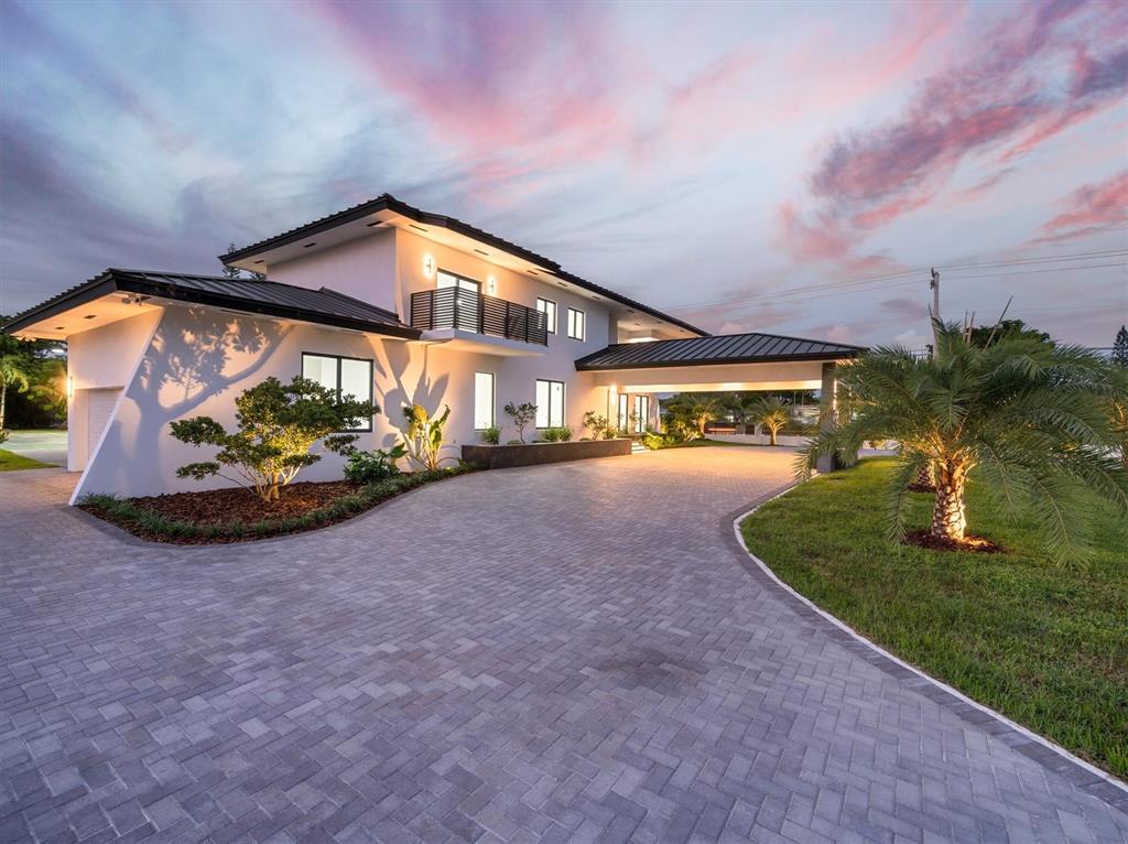 a view of a house with a yard porch and sitting area