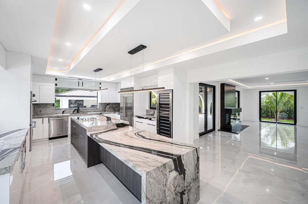 10201 Southwest 64th Street Miami, FL 33173 - Photo 11 of 50 a large kitchen with stainless steel appliances lots of counter space and windows