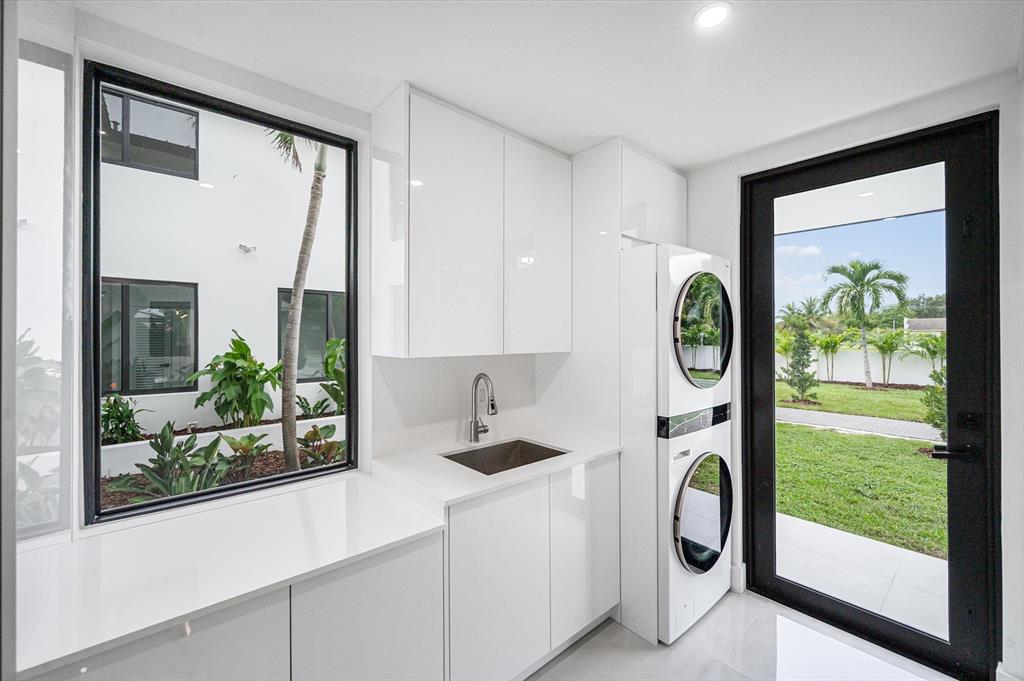 10201 Southwest 64th Street Miami, FL 33173 - Photo 13 of 50 a white kitchen with a large window