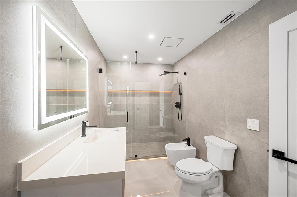 10201 Southwest 64th Street Miami, FL 33173 - Photo 14 of 50 a bathroom with a bathtub toilet and shower