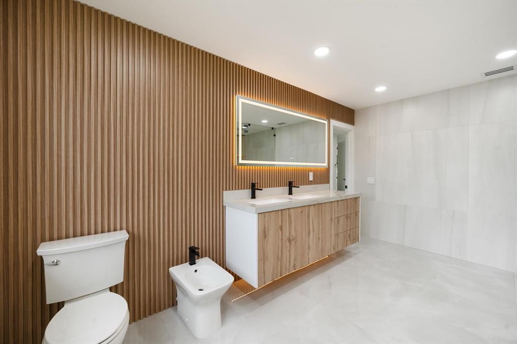 10201 Southwest 64th Street Miami, FL 33173 - Photo 26 of 50 a bathroom with a toilet a sink and mirror