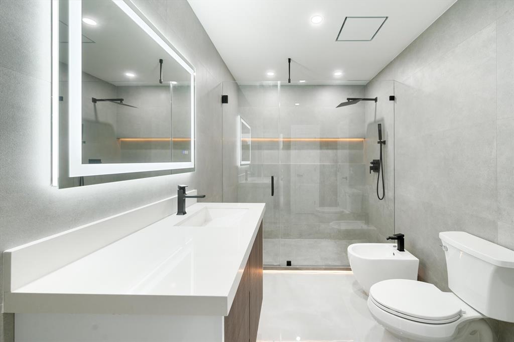 10201 Southwest 64th Street Miami, FL 33173 - Photo 28 of 50 a bathroom with a sink a toilet and shower