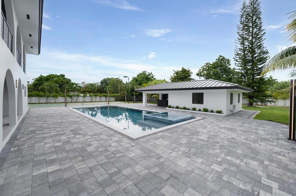 10201 Southwest 64th Street Miami, FL 33173 - Photo 35 of 50 a view of house with backyard and trees in the background