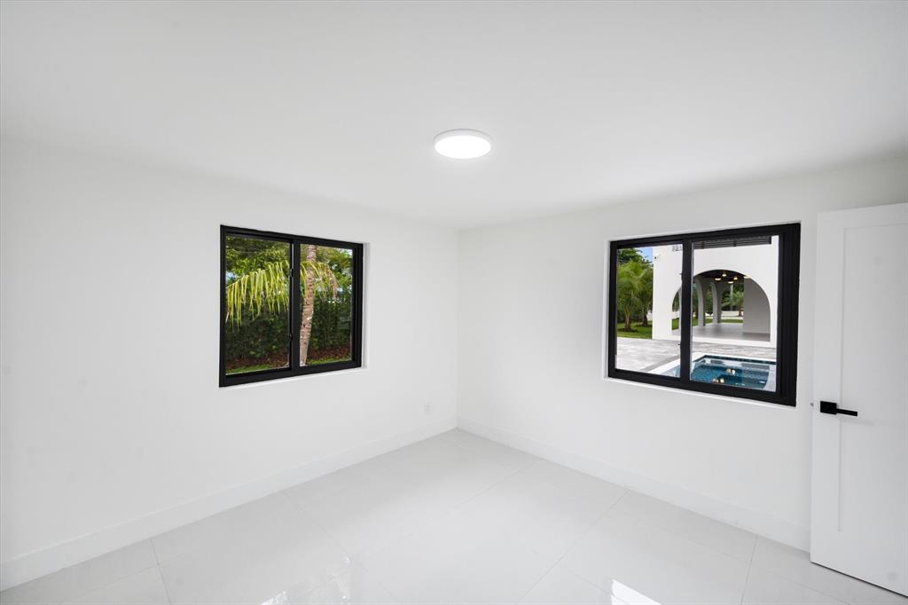 10201 Southwest 64th Street Miami, FL 33173 - Photo 41 of 50 an empty room with a window