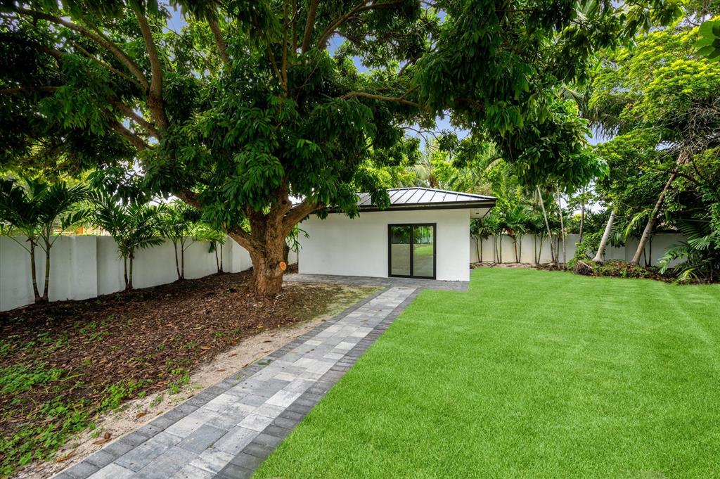 10201 Southwest 64th Street Miami, FL 33173 - Photo 43 of 50 a view of a yard with a house and a large tree