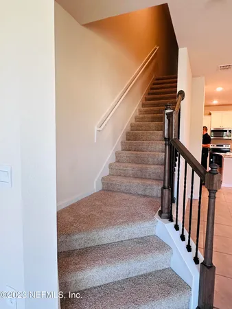 a view of a bathroom with a toilet and a shower