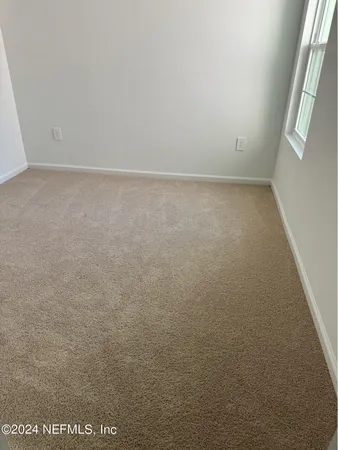 a view of a garden with lawn chairs