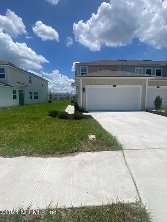 a view of a back yard of the house