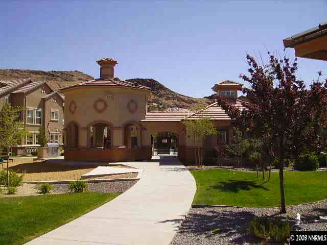 9050 Double R Boulevard, Unit 521 Reno, NV 89521 - Photo 2 of 6 a front view of a house with a yard garden