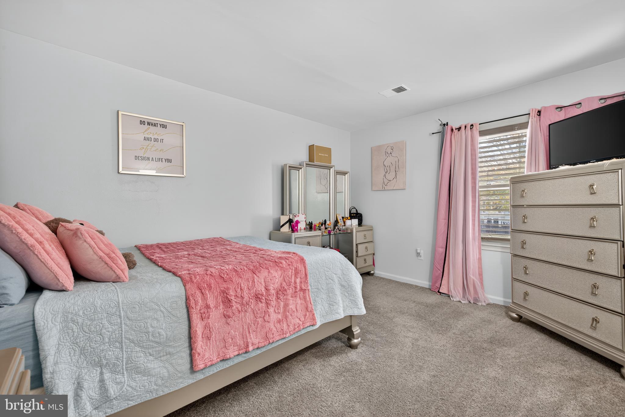 20617 Shadyside Way, Unit 997 Germantown, MD 20874 - Photo 12 of 23 a bedroom with a bed and a flat screen tv