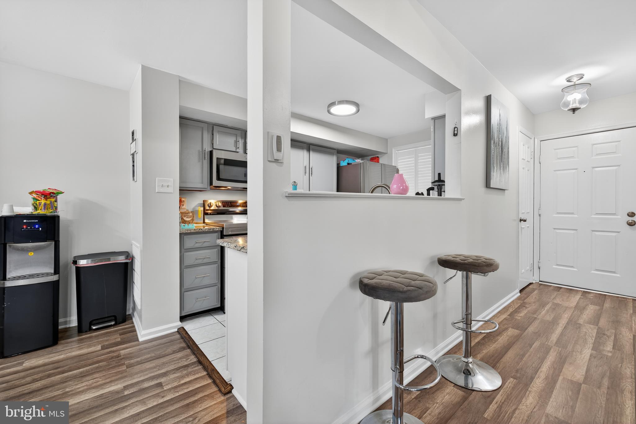 20617 Shadyside Way, Unit 997 Germantown, MD 20874 - Photo 2 of 23 a kitchen with stainless steel appliances granite countertop a refrigerator and a stove top oven